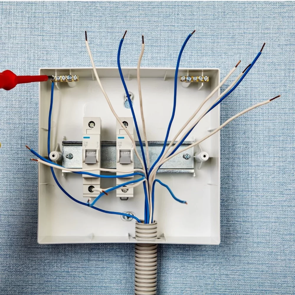 worker-connects-electric-wire-to-neutral-phase-picture-id1251580404
